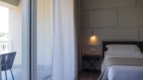 Postel nebo postele na pokoji v ubytování Solho Hotel
