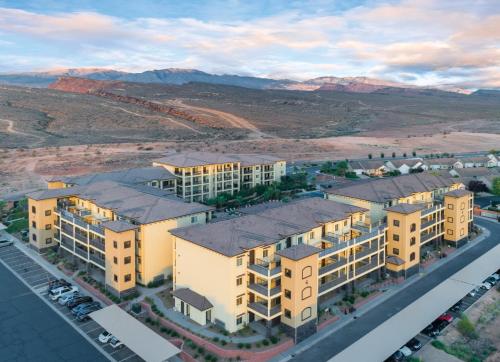 an aerial view of an apartment complex with mountains in the background at WorldMark Estancia in St. George