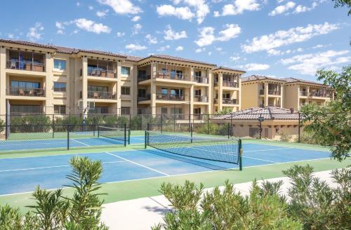 two tennis courts in front of a building at WorldMark Estancia in St. George