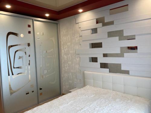 a room with a wall made out of tiles at Omega 6 in Odesa