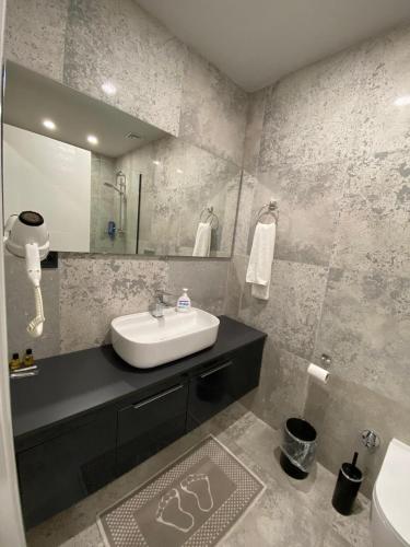 a bathroom with a sink and a mirror at Kent Suit Otel in Istanbul