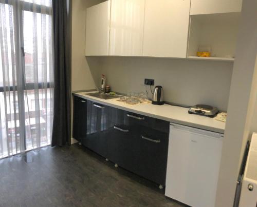 a kitchen with a sink and a counter top at Kent Suit Otel in Istanbul