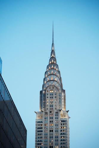 a tall building with a spire on top of it at The Jewel Hotel, New York in New York