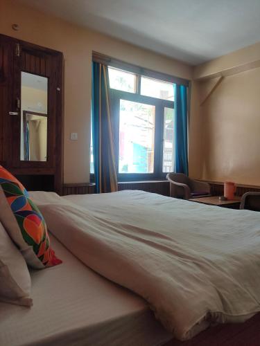 Hotel BHRIGUにあるベッド