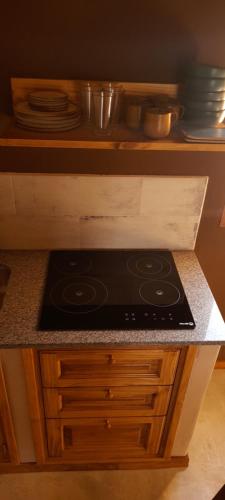 a stove top oven sitting on a counter in a kitchen at Tierra Quebrada Cabañas in Purmamarca