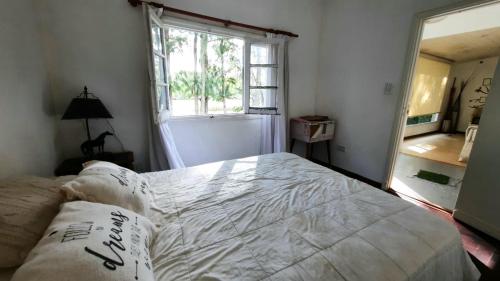Кровать или кровати в номере Muelle Amorcito