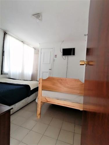 Postel nebo postele na pokoji v ubytování Hostal Caleta Abarca
