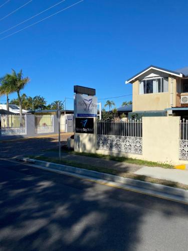 a street view of a house with a fence at Hervey Bay Motel in Hervey Bay