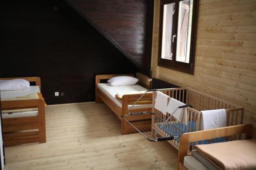 a attic room with two beds and a shopping cart at Tarweek - Mountain House 