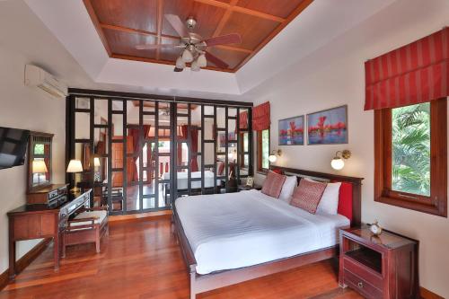 Ένα ή περισσότερα κρεβάτια σε δωμάτιο στο Siam Pool Villa Pattaya