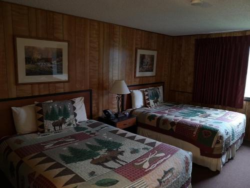 a hotel room with two beds in a room at Denali Park Hotel in Healy