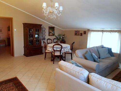 a living room with a couch and a table at Casa Adriana in Penne