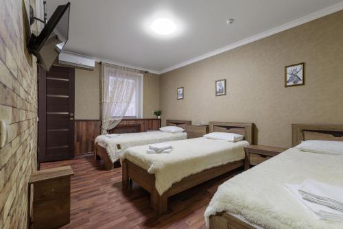Кровать или кровати в номере Авторский отель Шале