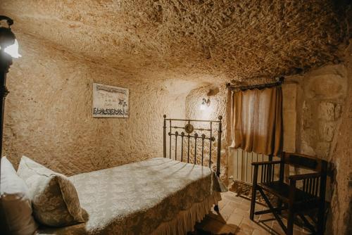 Postel nebo postele na pokoji v ubytování Melekler Evi Cave Hotel
