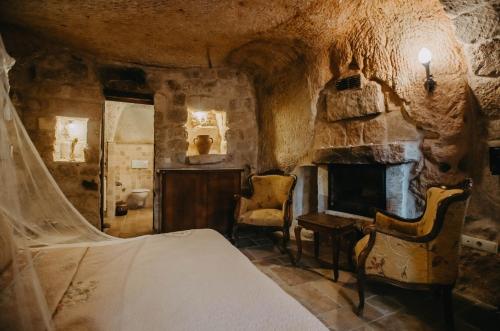 Postel nebo postele na pokoji v ubytování Melekler Evi Cave Hotel