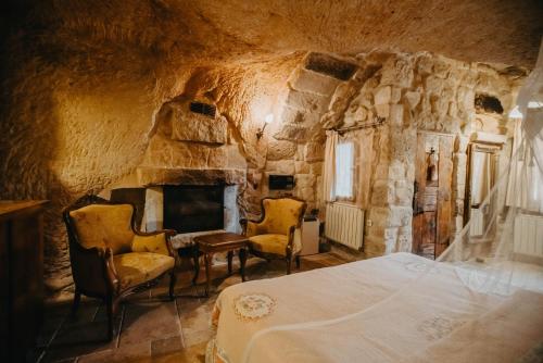 TV a/nebo společenská místnost v ubytování Melekler Evi Cave Hotel