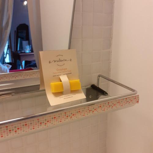 a box of cheese on a shelf in a bathroom at Les deux arches in Caunes-Minervois