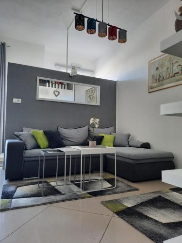 a living room with a couch and a table at Apartment GS CENTAR in Gospić
