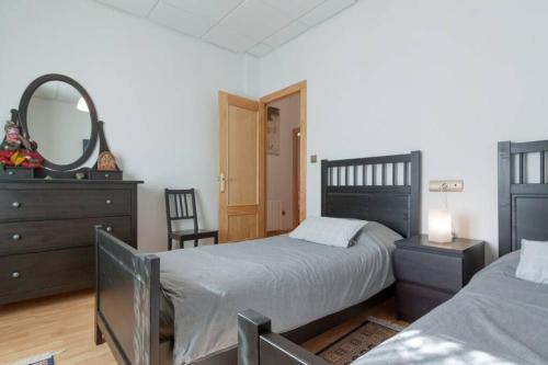 A bed or beds in a room at Casa entera en el centro de Cantabria