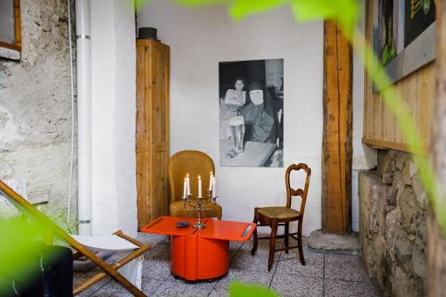 a room with a table and two chairs and candles at LA PITA in La Valle