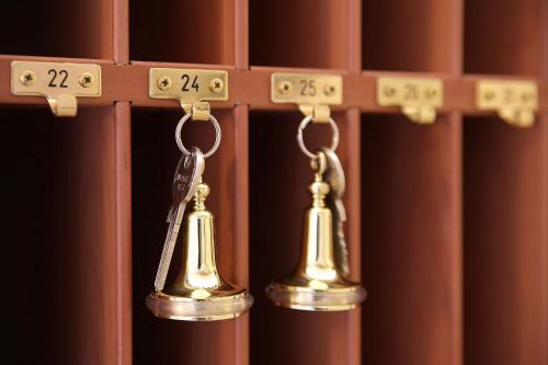 a pair of bells hanging on a wooden shelf at Rungholt in Helgoland
