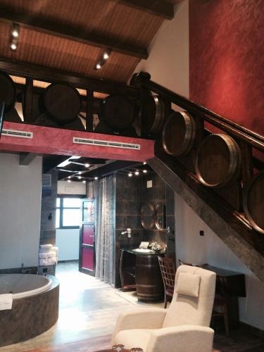 a room with a staircase with pots and pans at Hotel SPA El Lagar de Isilla in La Vid y Barrios