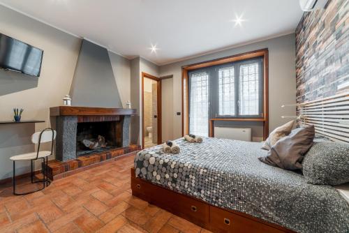 a bedroom with a bed and a fireplace at B&B Papa Leone Countryrooms in Rome