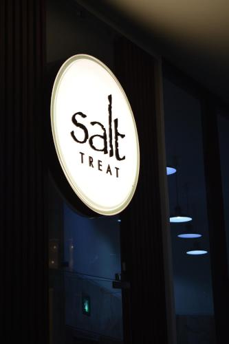 a sign that says sale treat on the side of a door at Comfort Inn Tulip Heights in Bathinda