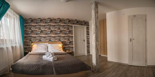 Postel nebo postele na pokoji v ubytování Apartmány Habovka