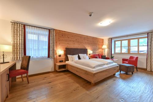 Ένα ή περισσότερα κρεβάτια σε δωμάτιο στο Hotel Helmer