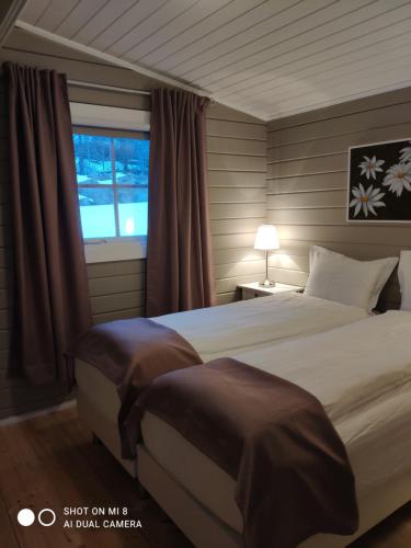 Katil atau katil-katil dalam bilik di Laugar Guesthouse