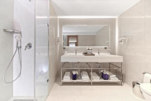 a bathroom with a sink and a shower at Lady Diana Hotel in Istanbul