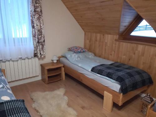 Postel nebo postele na pokoji v ubytování Dom na Krzemienicy