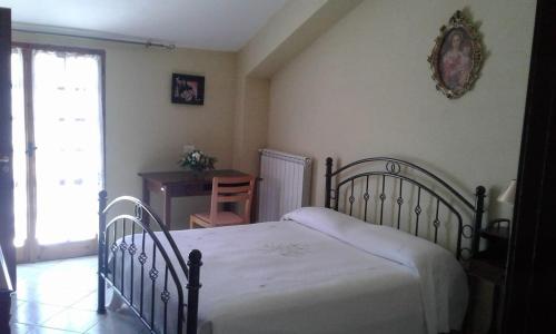 Ένα ή περισσότερα κρεβάτια σε δωμάτιο στο B&B PASSO DEL FALCO