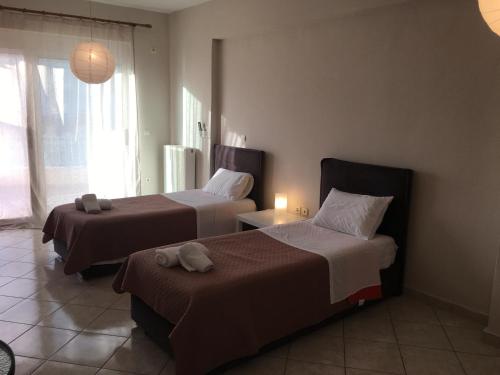 Postel nebo postele na pokoji v ubytování Theros Apartment Preveza