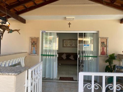 a church entrance with a cross on the wall at Pousada Nova Estrela da Canastra in Delfinópolis