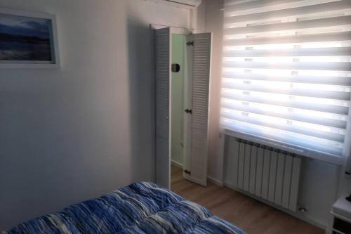 Ένα ή περισσότερα κρεβάτια σε δωμάτιο στο Meli's House