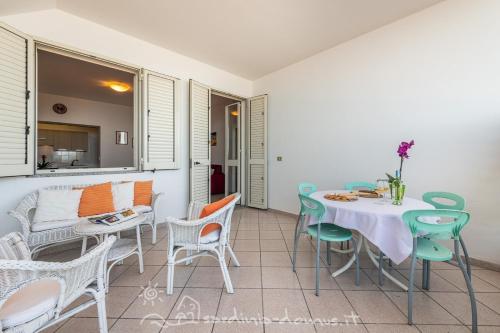 a dining room with a table and chairs at Casa Acqua Dolce in Cala Gonone