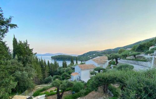 a house on a hill with a view of the water at Paleopetres K-Nine - Premium Suite - Kalami - in Kalami