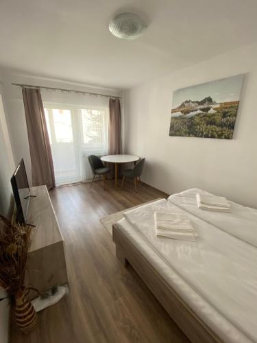Ένα ή περισσότερα κρεβάτια σε δωμάτιο στο Focus Home Next