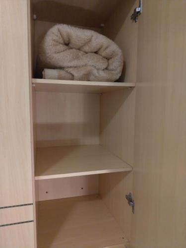 a roll of towels sitting in a closet at Apart Hotel Quartier Latin in Vitória