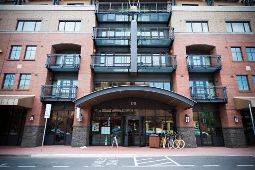 a large brick building with an entrance with bikes parked outside at Oxford Hotel Bend in Bend