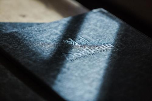 a close up of the back of a black book at s'Hoamatl Dorfkrug Appartements in Seefeld in Tirol
