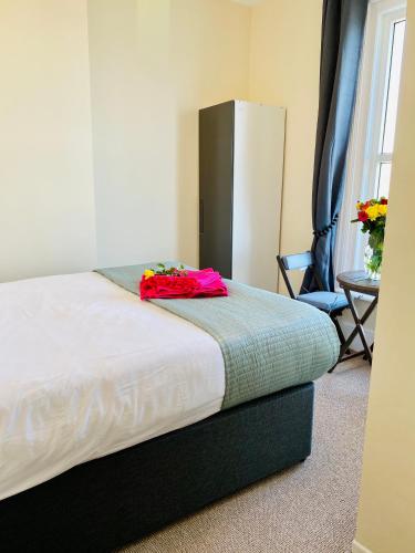 a bed in a room with at Villa Mentone Hotel in Shanklin