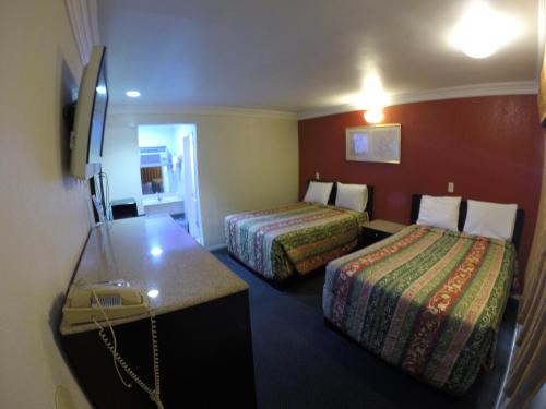 מיטה או מיטות בחדר ב-Calico Motel
