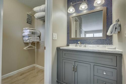 a bathroom with a sink and a mirror at Bay Oaks C 2nd Floor in Siesta Key