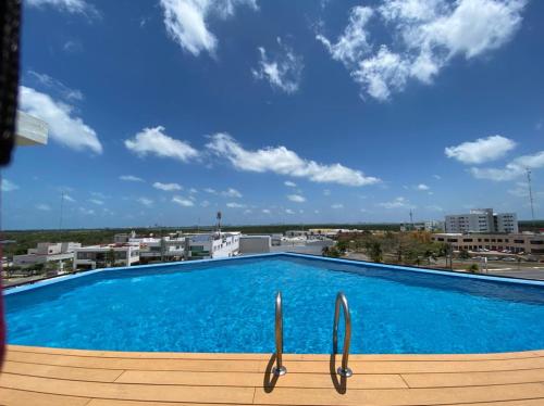 a large swimming pool on top of a building at San Francisco by Andiani Travel in Cancún