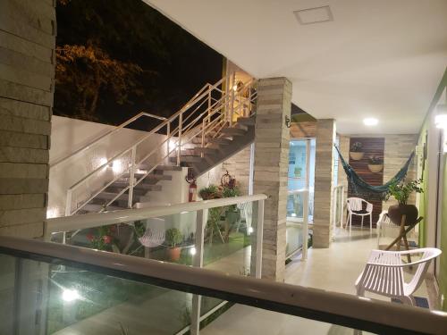a staircase in a house with a glass floor at Flats Angatu Porto de Galinhas PE in Porto De Galinhas