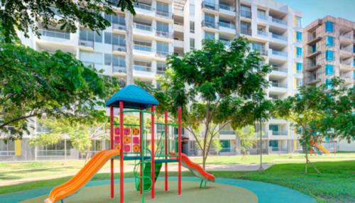 a playground with a slide in a park at Apartamento en Ricaurte Peñazul la Morada in Ricaurte