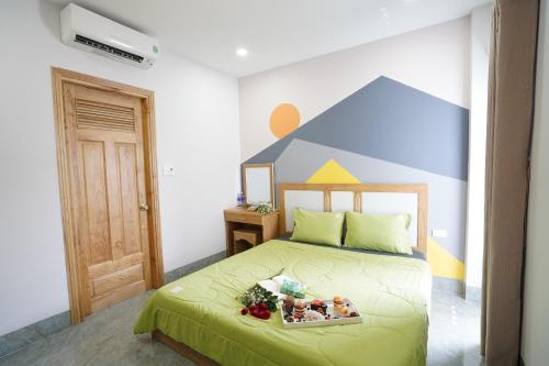 מיטה או מיטות בחדר ב-COCA HOTEL & APARTMENT